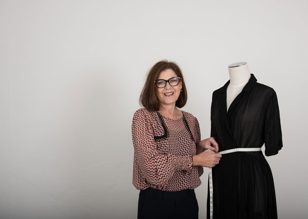 Nardia Robertson pictured measuring an item of clothing.