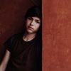 How to be a teen with a chronic illness | Teenage boy leaning against a wall