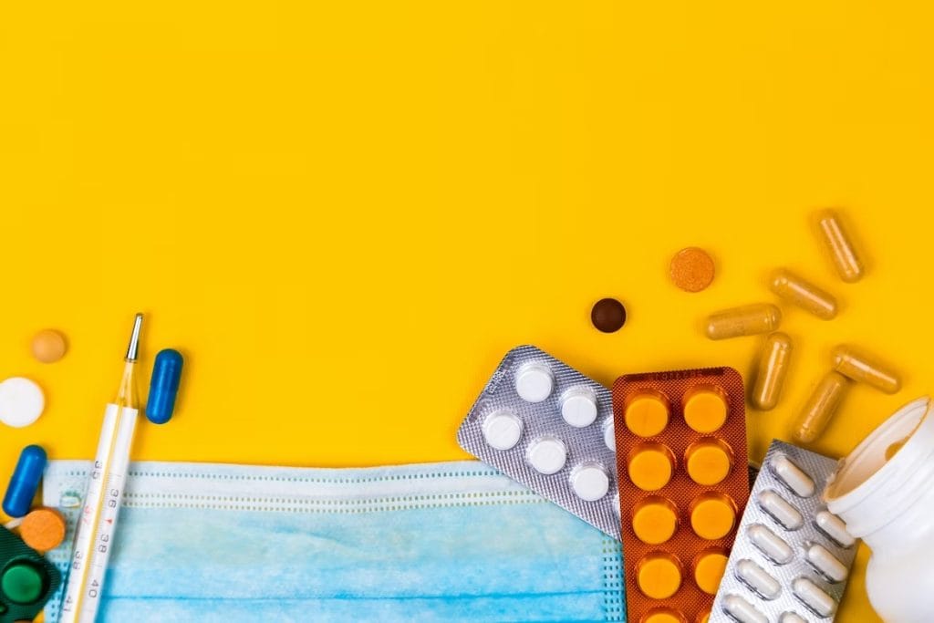 Trikafta side effects | Images of different medicines and a mask