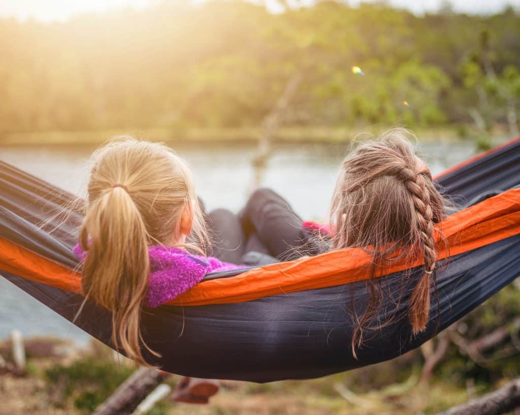 Kids getting Cystic Fibrosis | Two girls relaxing on a hammock