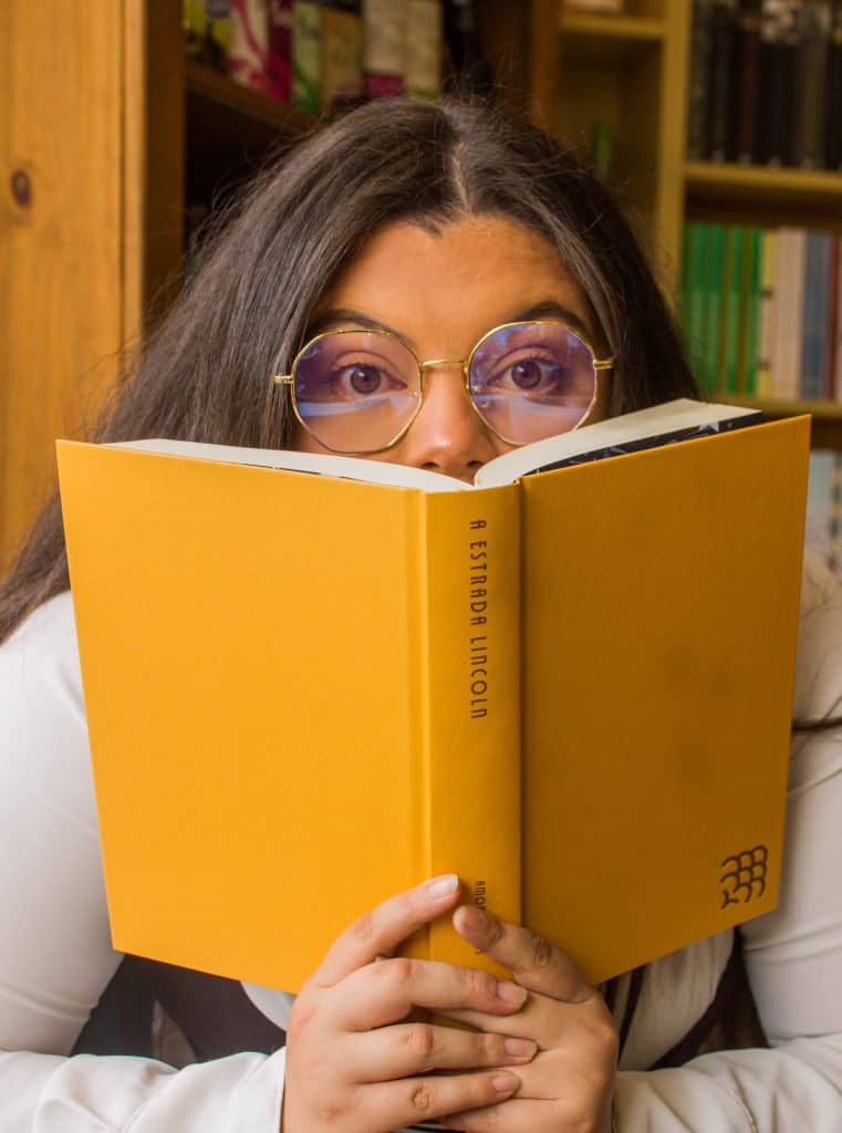 Thrush and Cystic Fibrosis | Girl covering her face with a book