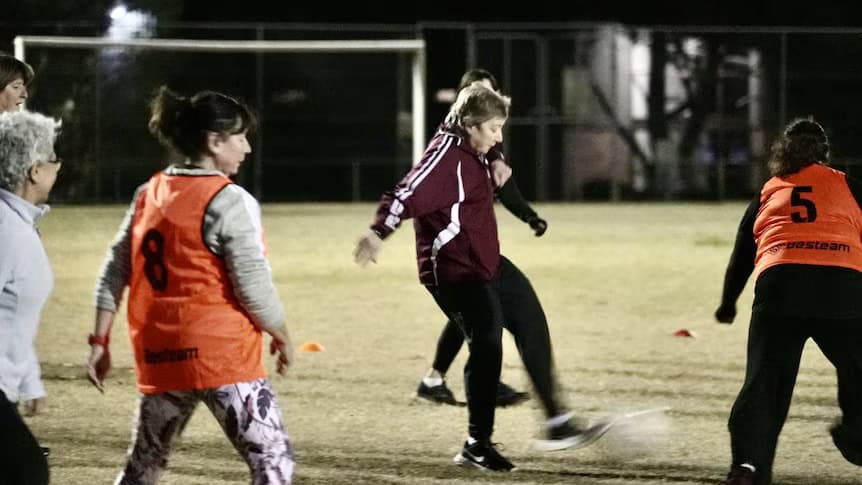 Women playing with a ball on a field | CF and Football |